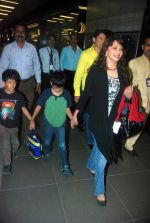 Madhuri Dixit snapped with kids and husband at the airport in Mumbai on 1st Jan 2012